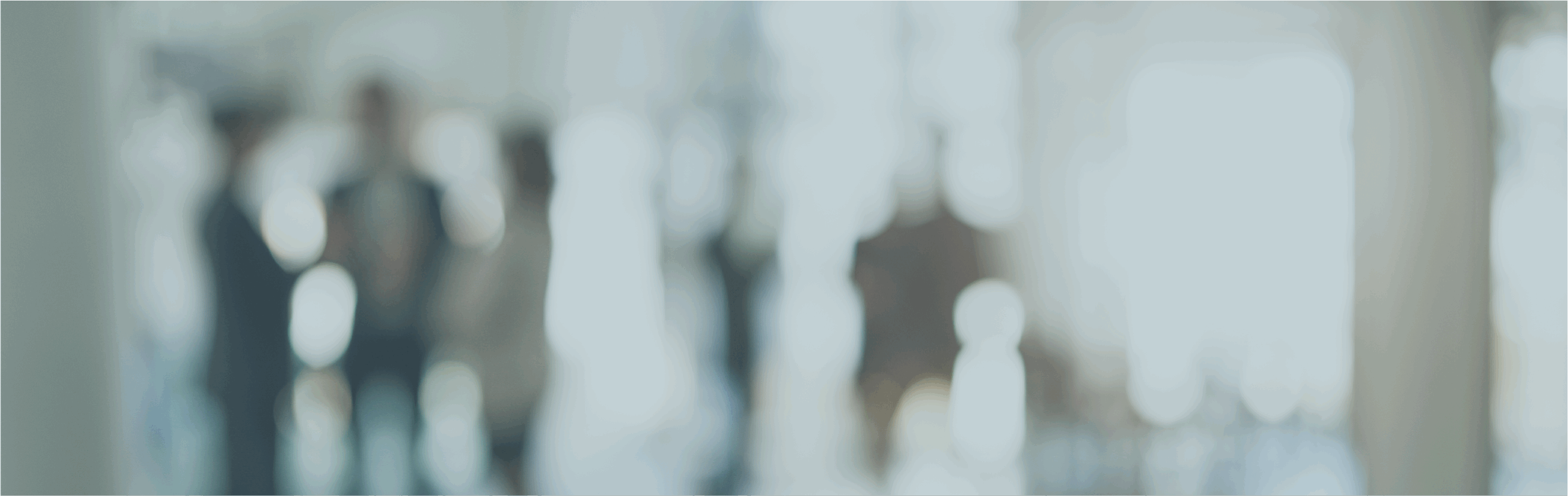 Blurred image of business people talking in an office.