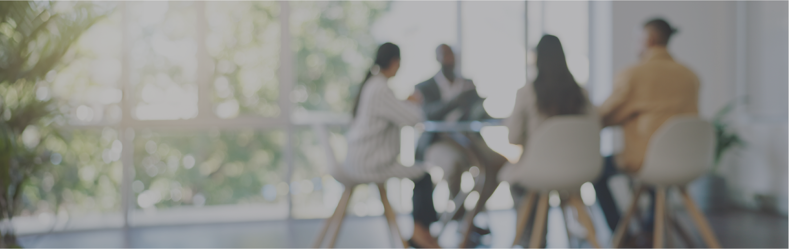 Blurred image of business meeting in modern office.