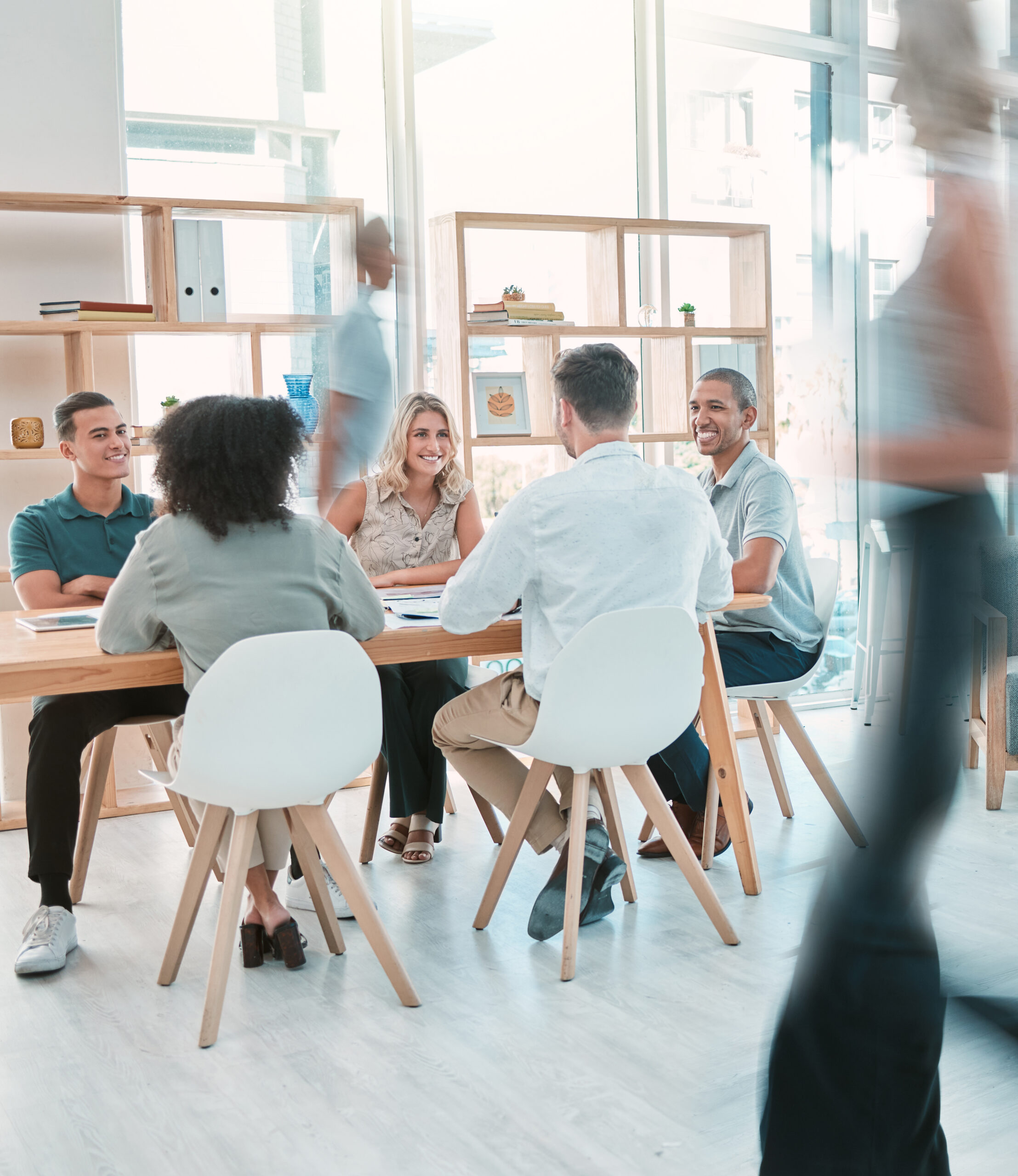 Startup, business meeting and office busy with creative happy team of men and women working on marketing project together. Vision, collaboration and motion, teamwork mission for fast business success